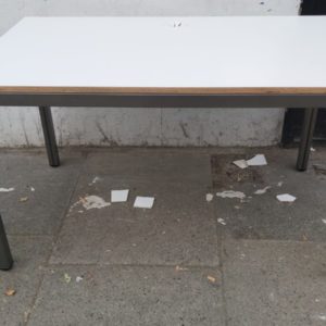 A White Top Office Table With Crushed Steel Frame