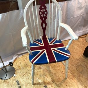 A White Wood Chair With Flag Paint