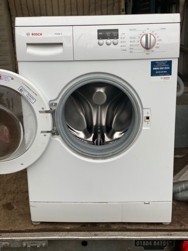A White Color Washing Machine With Door Open