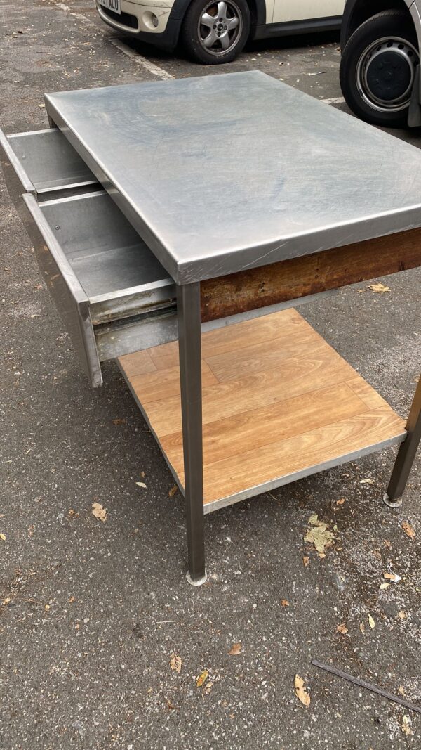 A Stainless Steel Preparation Table With Two Drawers
