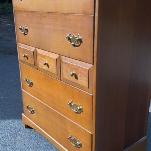 Walnut coloured five drawer tallboy with three smaller drawers