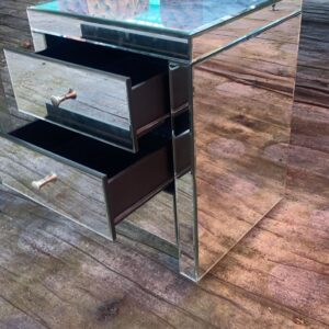 Contemporary mirrored three drawer bedside table/lamp table, has a slight break on back corner