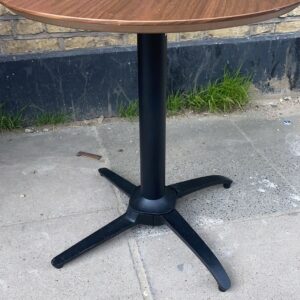 Seven flip top bistro tables in walnut with black metal NoRock stands
