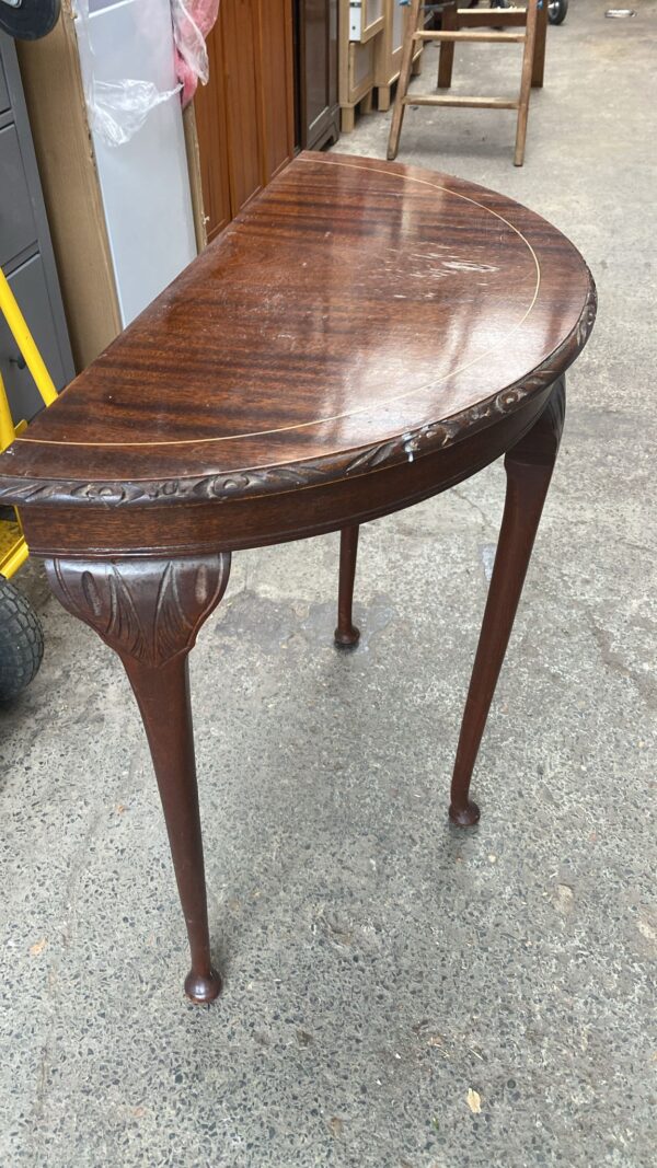 Regency style half moon Table, has some water damage on top