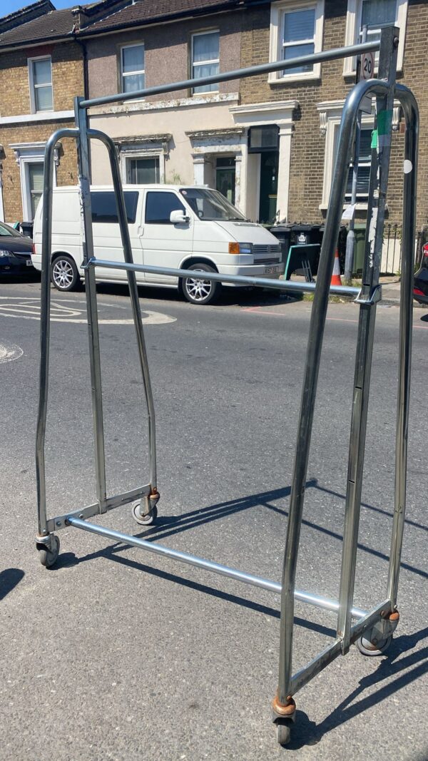 Seven industrial dress rails, middle bar is adjustable, very strong