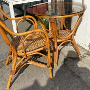 Glass bamboo and wicker circular table with matching chair