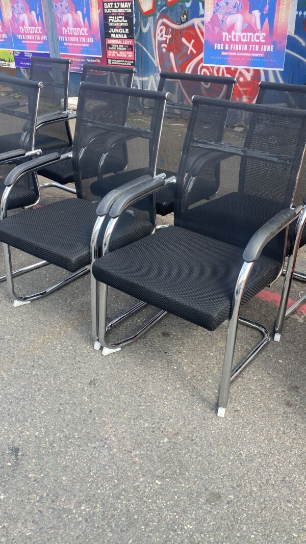 Eight chrome and Black counterbalance office/waiting Chairs
