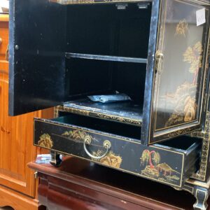 Two ebony black painted oriental cupboards with drawers