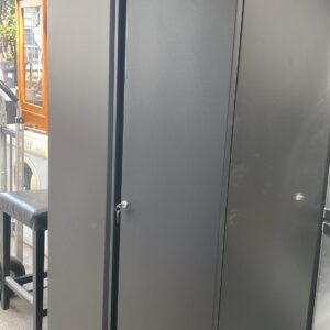 Lockable stationary cabinet with three moveable shelves and a key